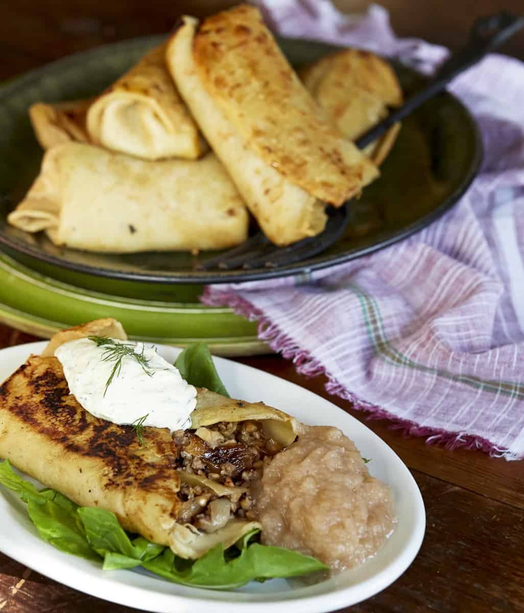 A plate of kasha blintzes on a table during a cooking class.