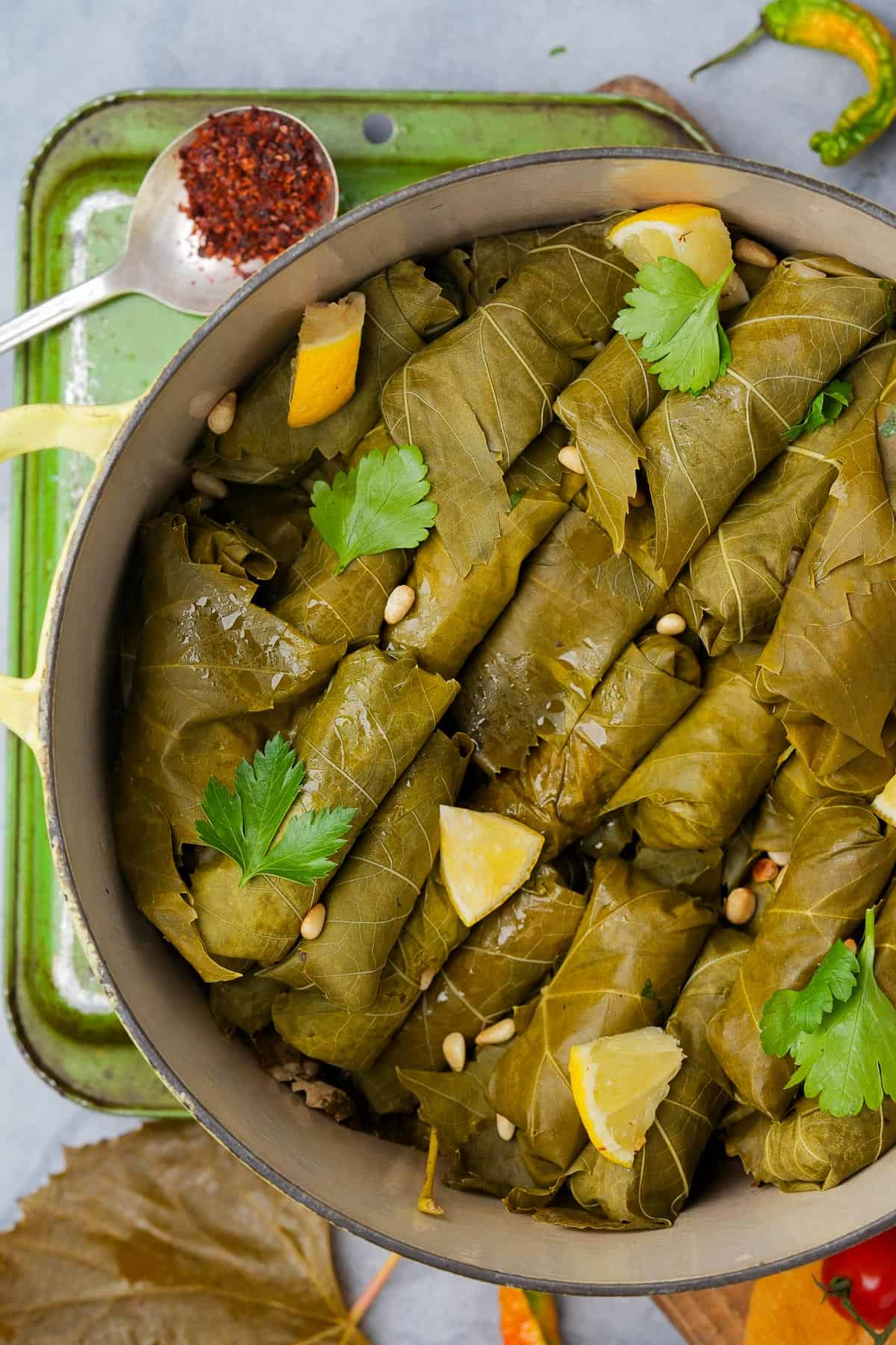 Stuffed grape leaves in a pot on a table.