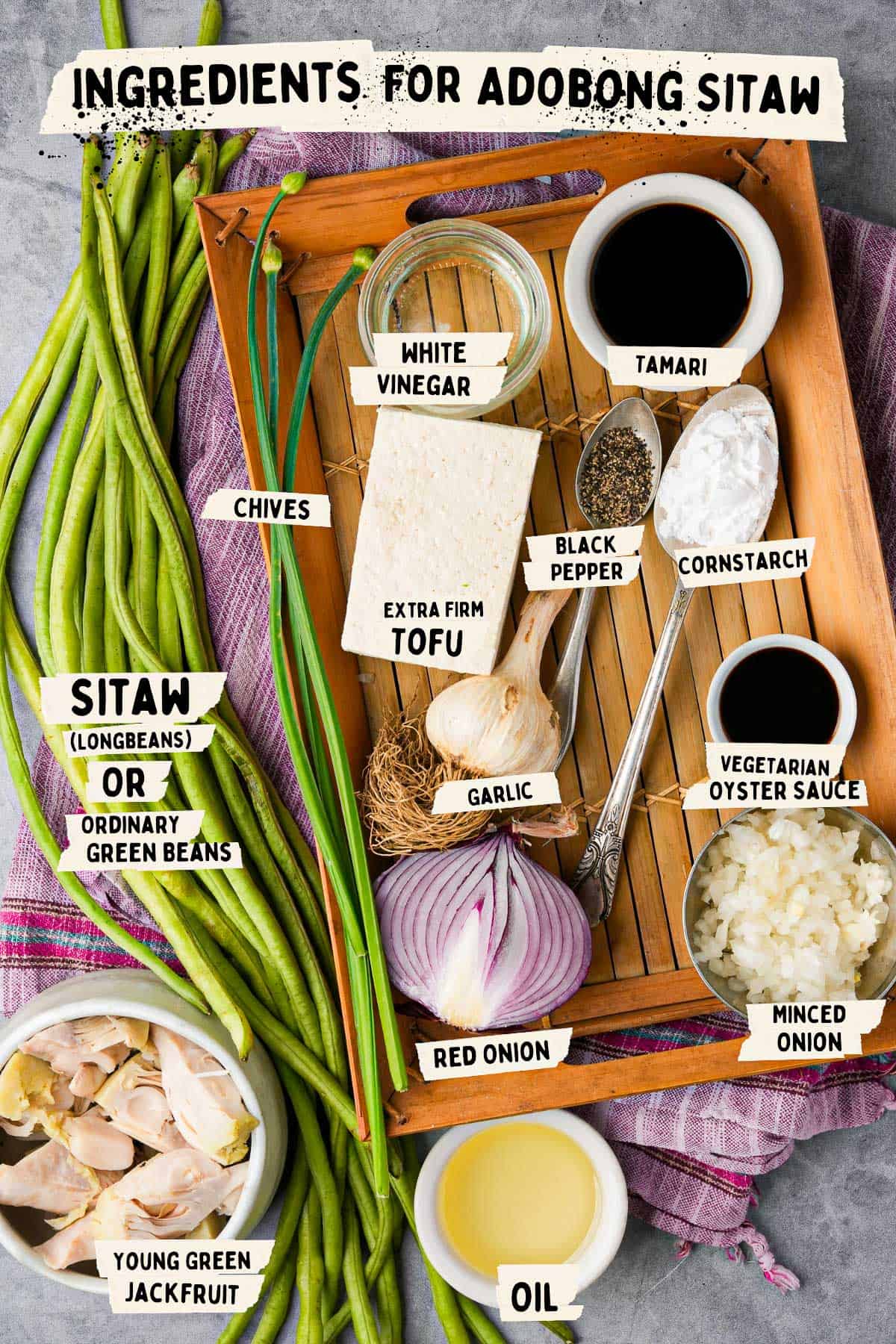 Ingredients for adobong sitaw laid out on a tray.