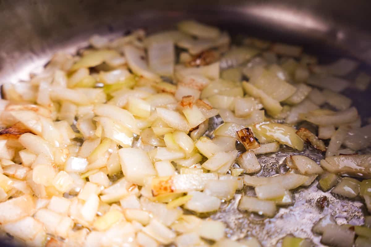 Onions are being lightly browned in hot oil.