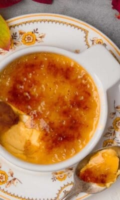 A vegan bowl of vegan crème brulee with a spoon.