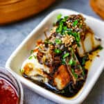 chee cheong fun in a small white dish on a table.