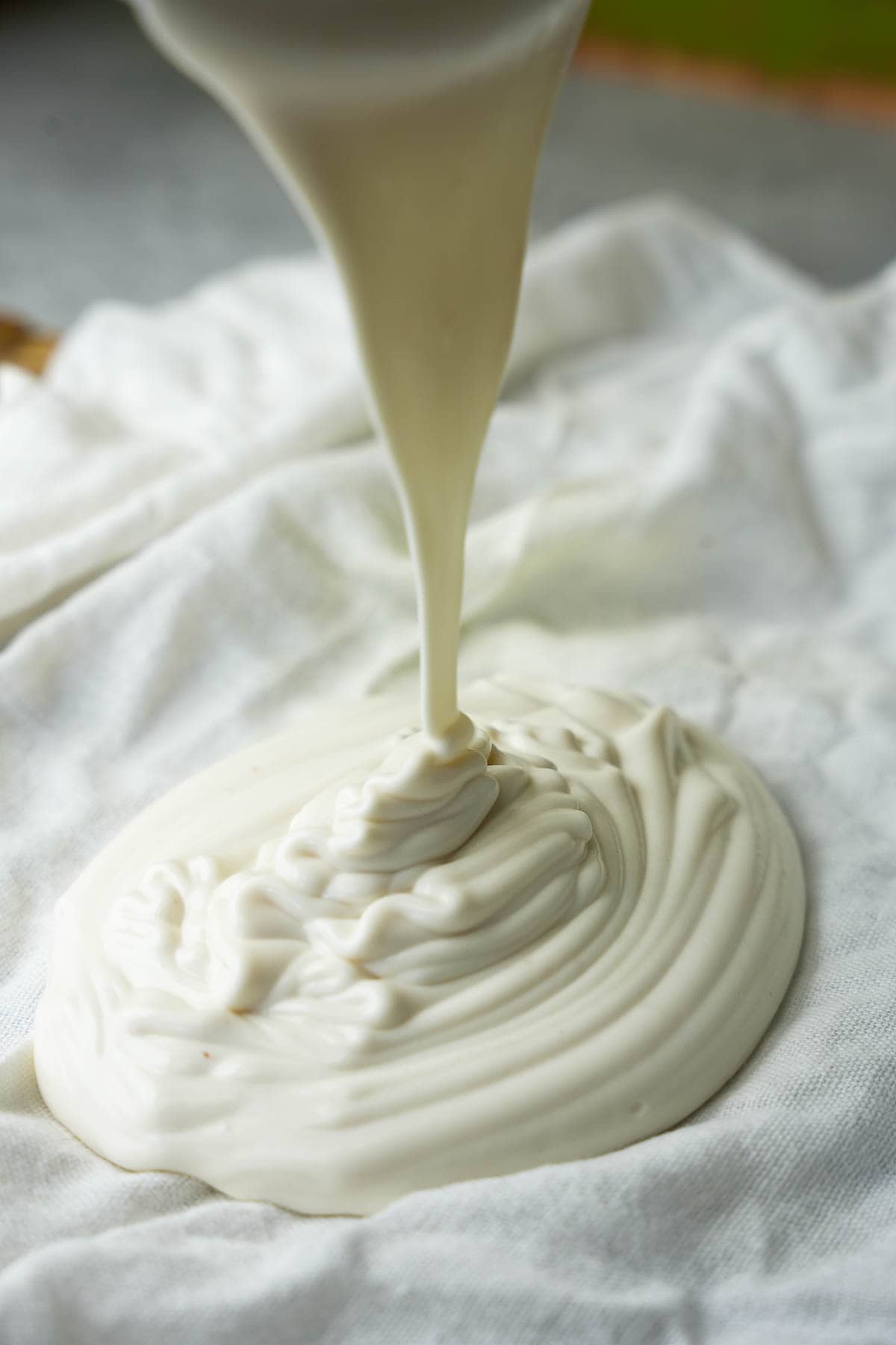 the salted yogurt mixture is pored into prepared clean cheesecloth.