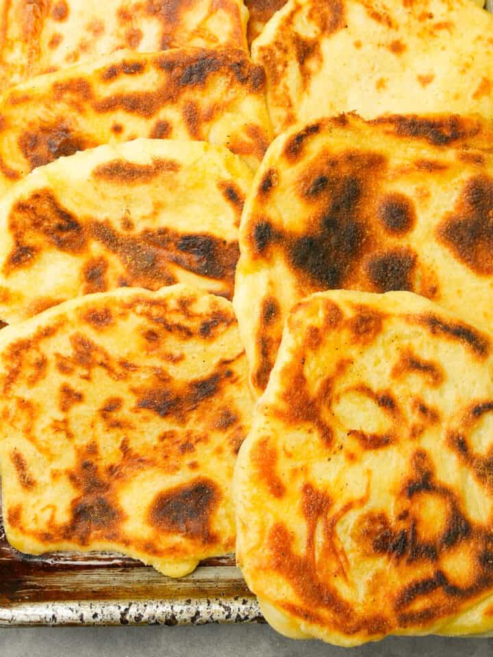 A metal sheet pan full of freshly baked Moroccan pancakes.