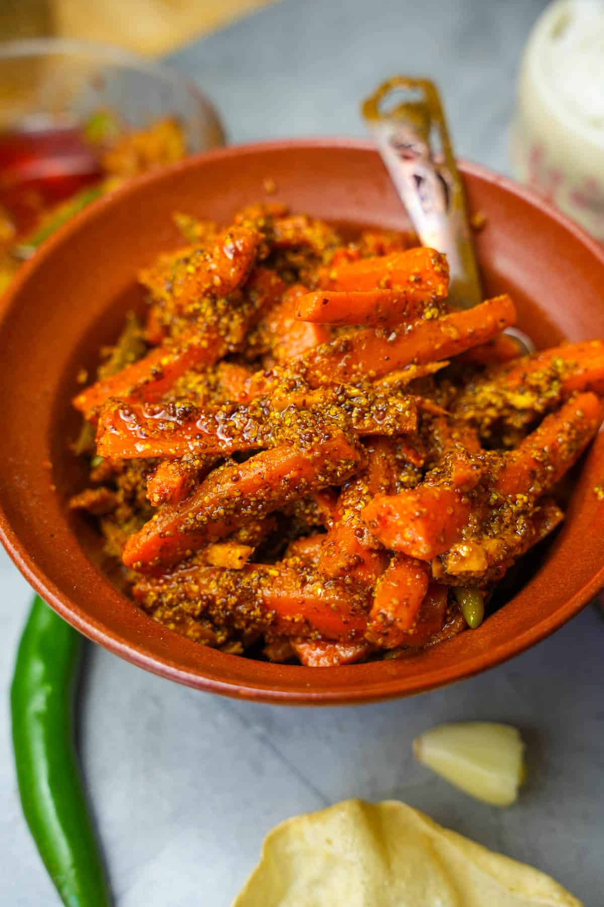 carrot pickle in ann orange ceramic bowl,