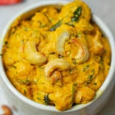 A bowl of pohool makhana curry with cashews.