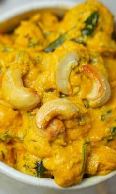 A bowl of pohool makhana curry with cashews.
