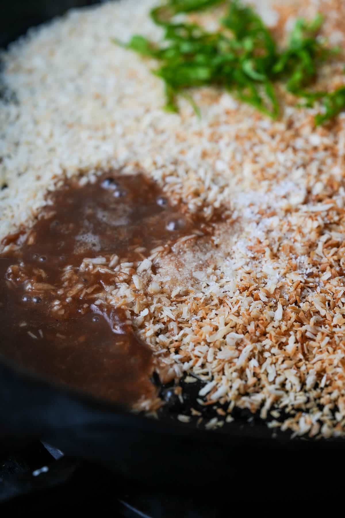 A frying pan with a brown sauce on it.