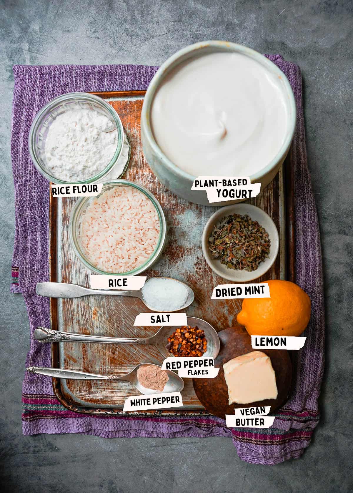 Ingredients for making yalya corbasi are measured and labeled on a metal tray.