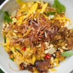 A white ceramic bowl with Vietnamese rice paper salad in it.