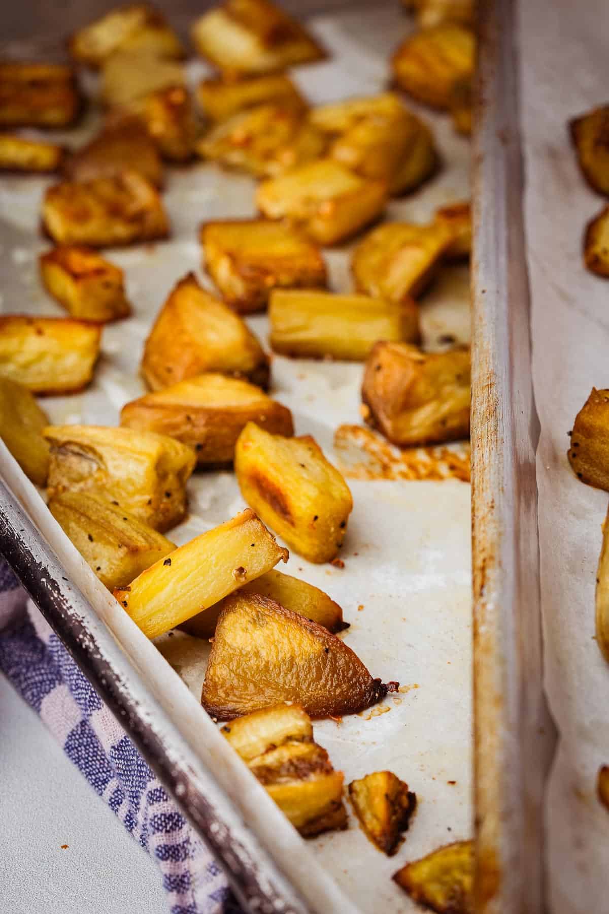 Roasted eggplant on a baking sheet.