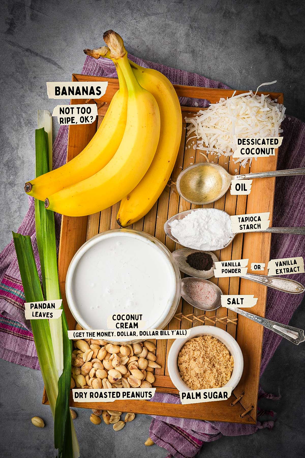 A top-down view showcases ingredients for Kem Chuoi on a wooden tray, featuring bananas, desiccated coconut, coconut cream, pandan leaves, peanuts, palm sugar, salt, oil, vanilla powder and extract, along with tapioca starch.