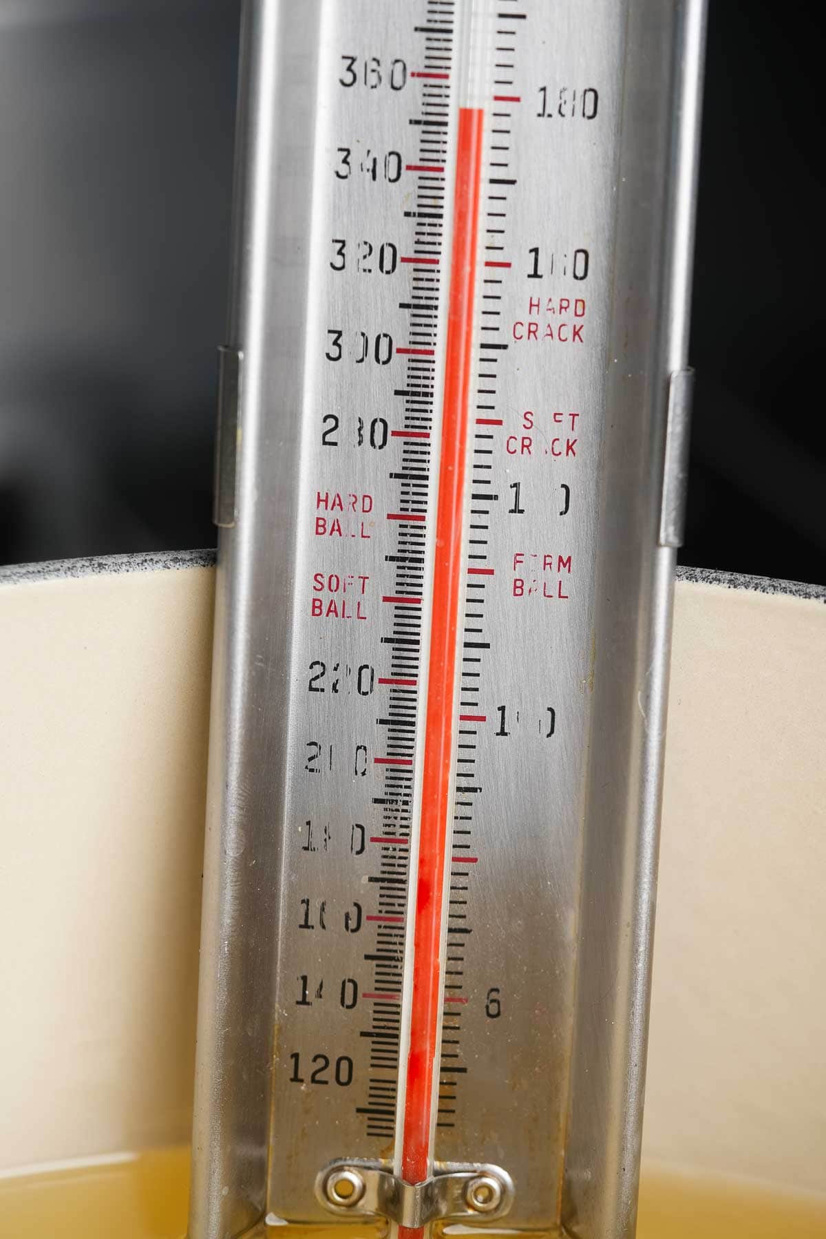 A close up of a thermometer in a pot.