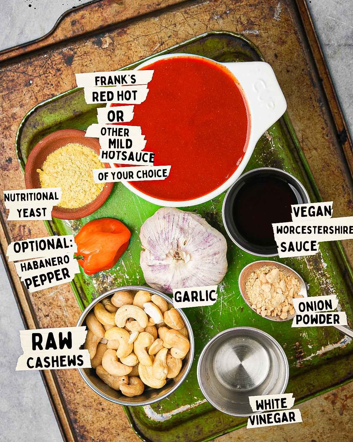 Ingredients for vegan buffalo sauce laid out on a metal tray.