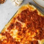 Baked zucchini boat filled with cheese and vegan baked ziti.