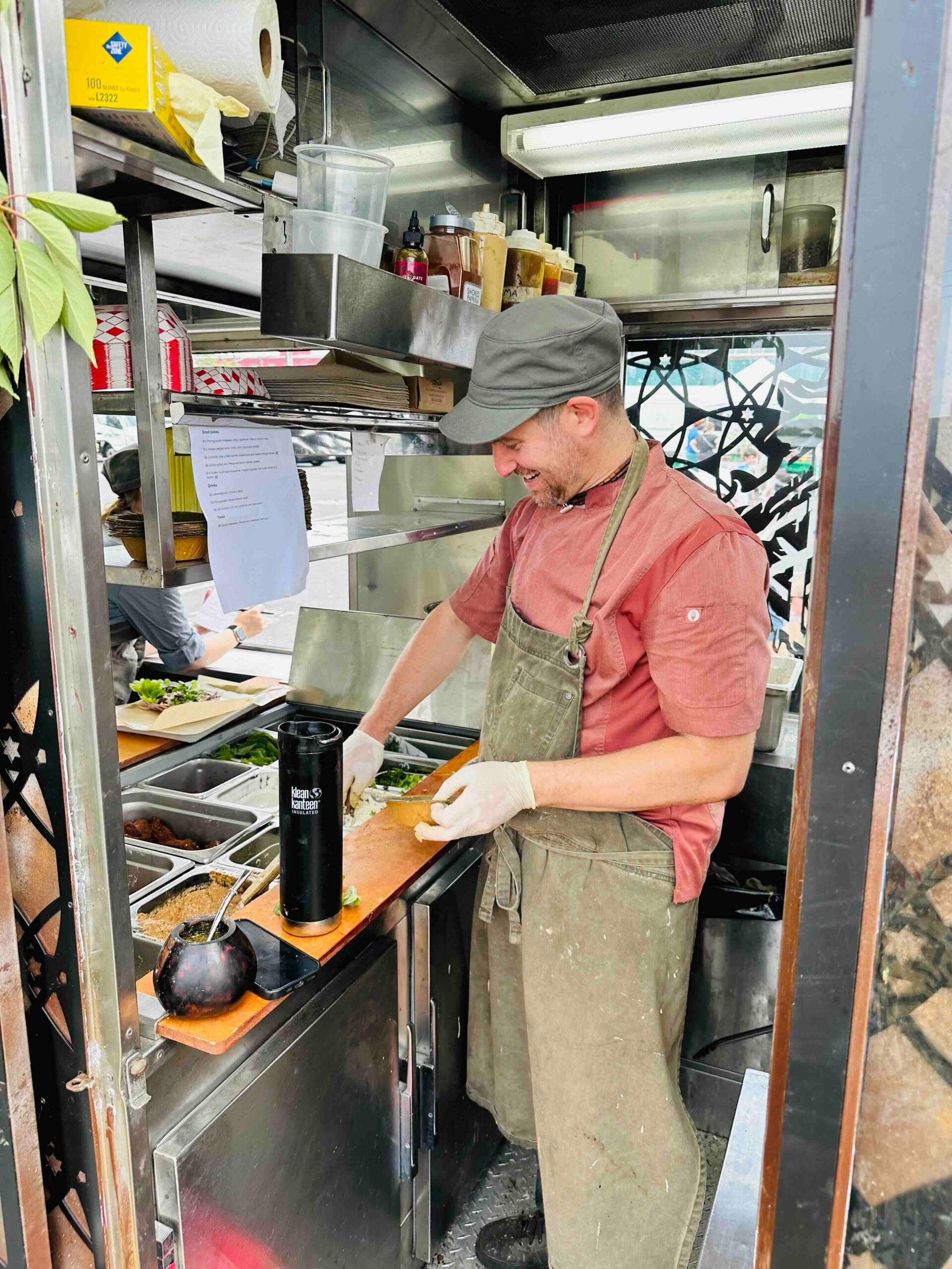 Chef Adam Sobel working inside the Galactic MegaStallion micro kitchen.
