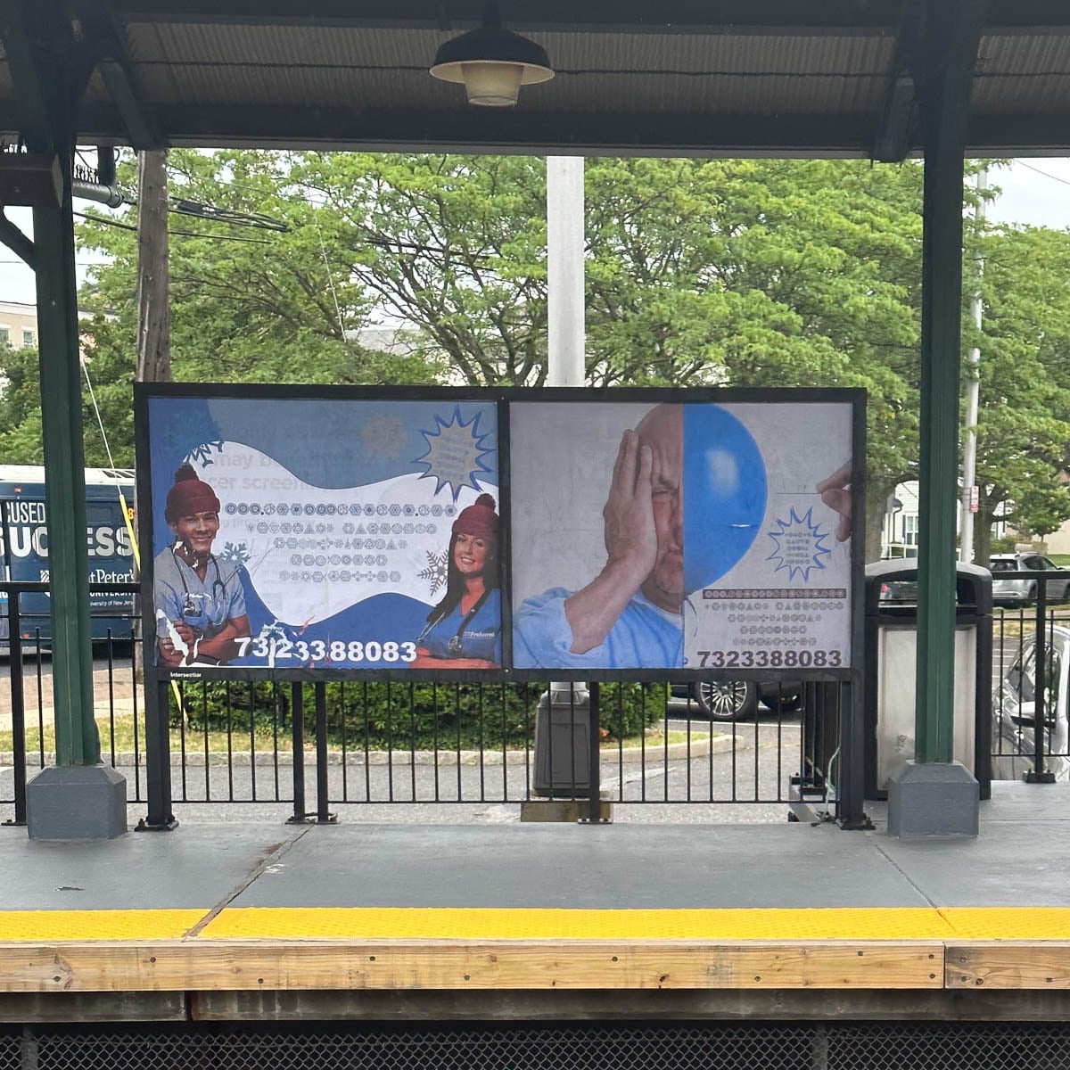 A billboard at a train station platform displays a galactic megastallion billboards.