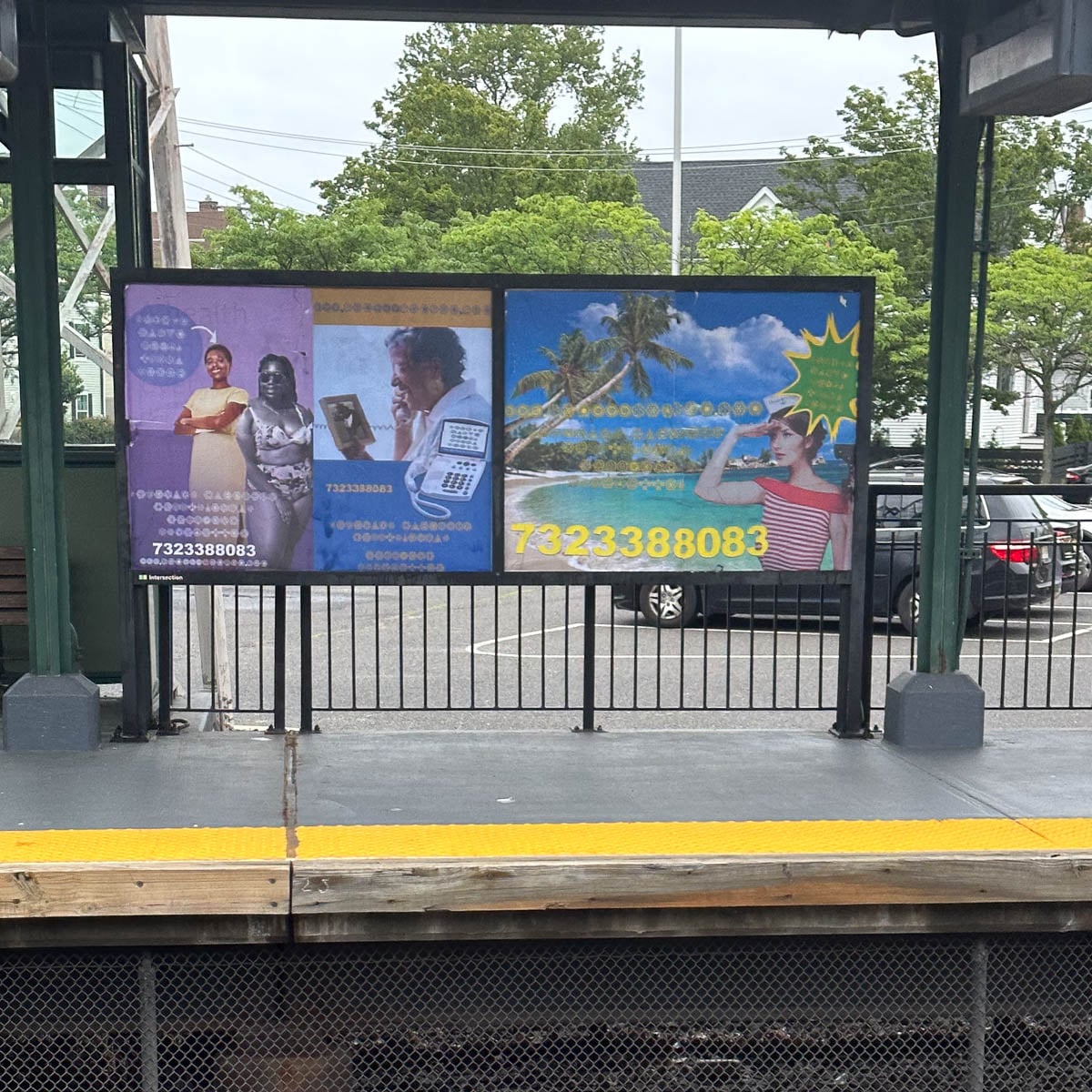 A billboard at a train station platform displays a galactic megastallion billboards.