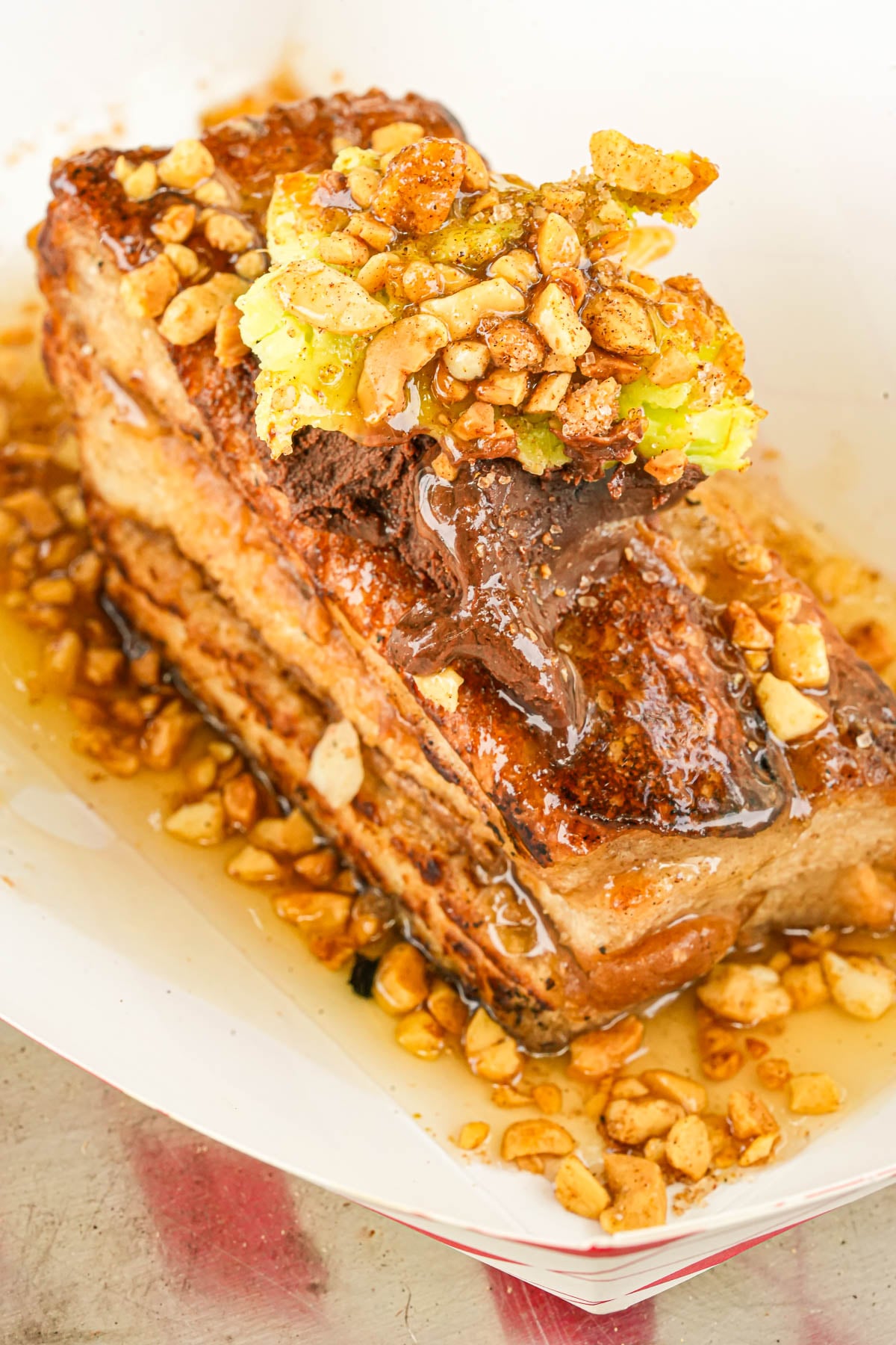 Malaysian spiced peanut French toast.
Clove ganache, Whipped pandan butter, lemongrass palm sugar syrup.