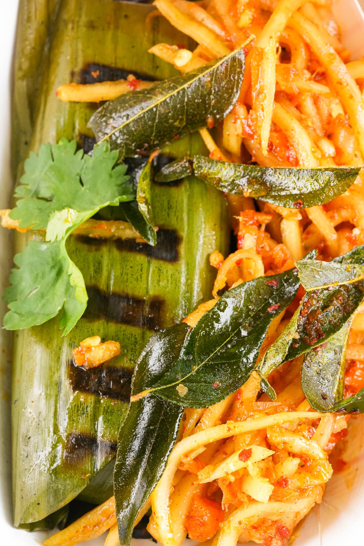 Char grilled coconut sticky rice. Green papaya sambal, fried curry leaves.