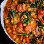Freshly cooked harissa chickpeas in a skillet.
