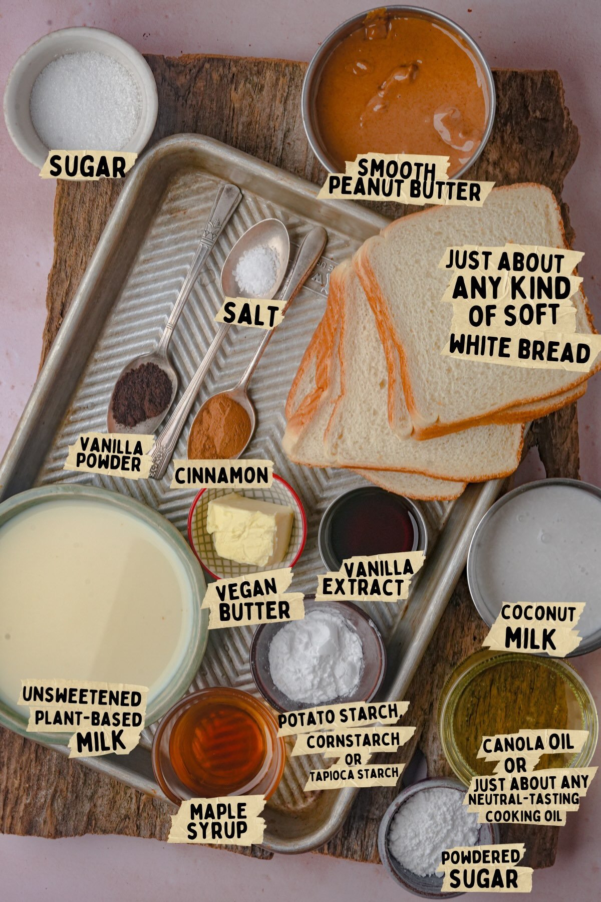 Various labeled ingredients for a vegan Hong Kong french toast recipe, including soft white bread, peanut butter, sugars, spices, plant-based milk, vegan butter, starch, vanilla, maple syrup, coconut milk, and oils.