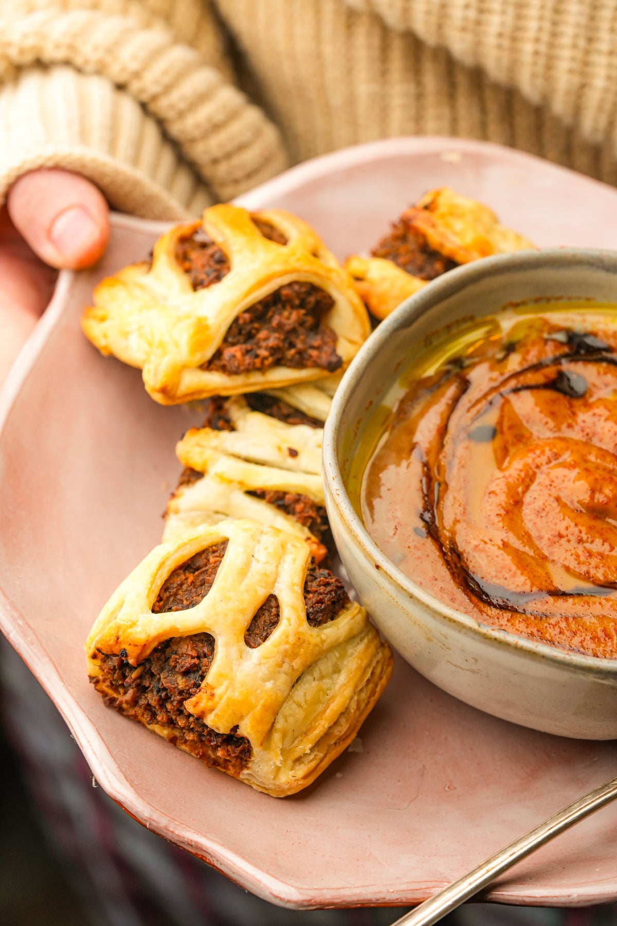 Flaky vegan sausage rolls with dipping sauce, a passed hors d'oeuvre