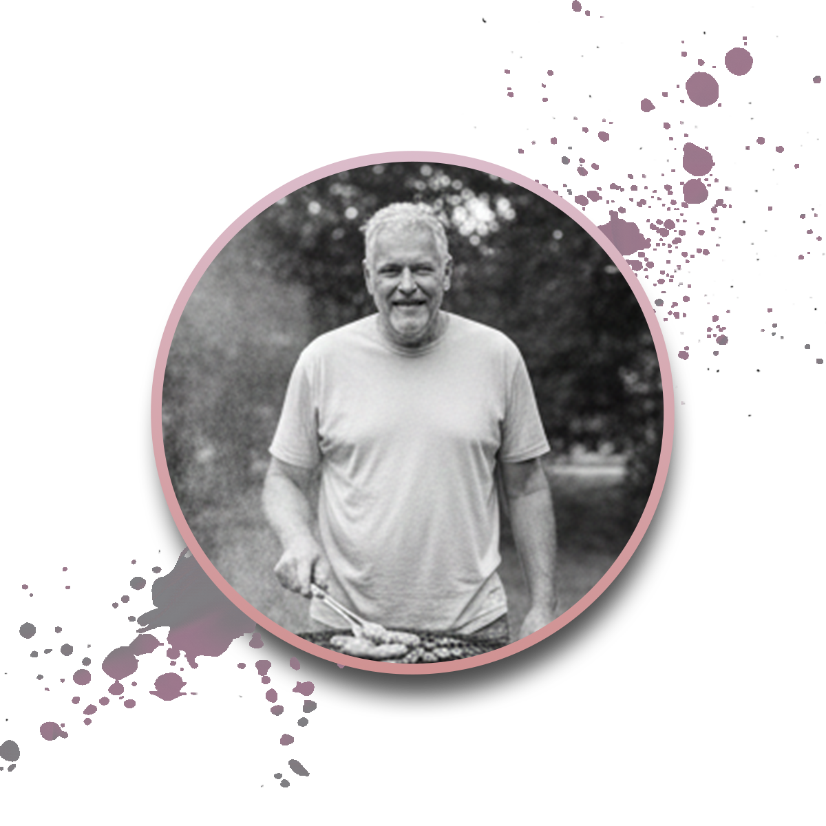 A smiling older man grills food outdoors, wearing a light t-shirt. The black-and-white circular image is framed with a pink border, set against a white background with purple paint splatters.