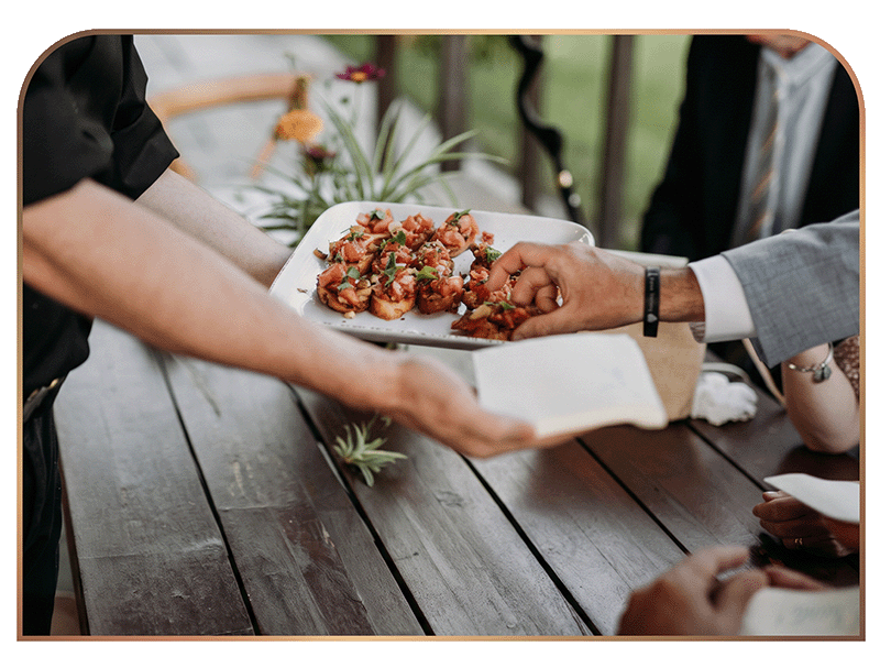 Vegan bruschetta passed to wedding guests by Cinnamon Snail catering staff