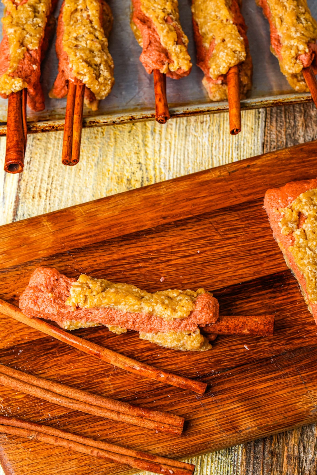 Layered seitan cut into ribs with cinnamon sticks pushed in to look like bones.
