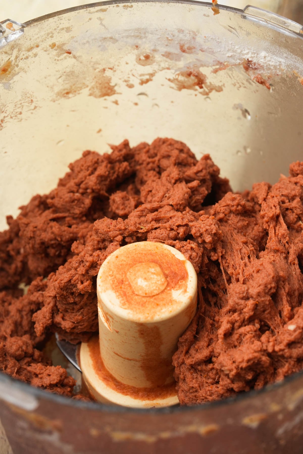 Lemongrass seitan dough processed until stringy in a food processor.