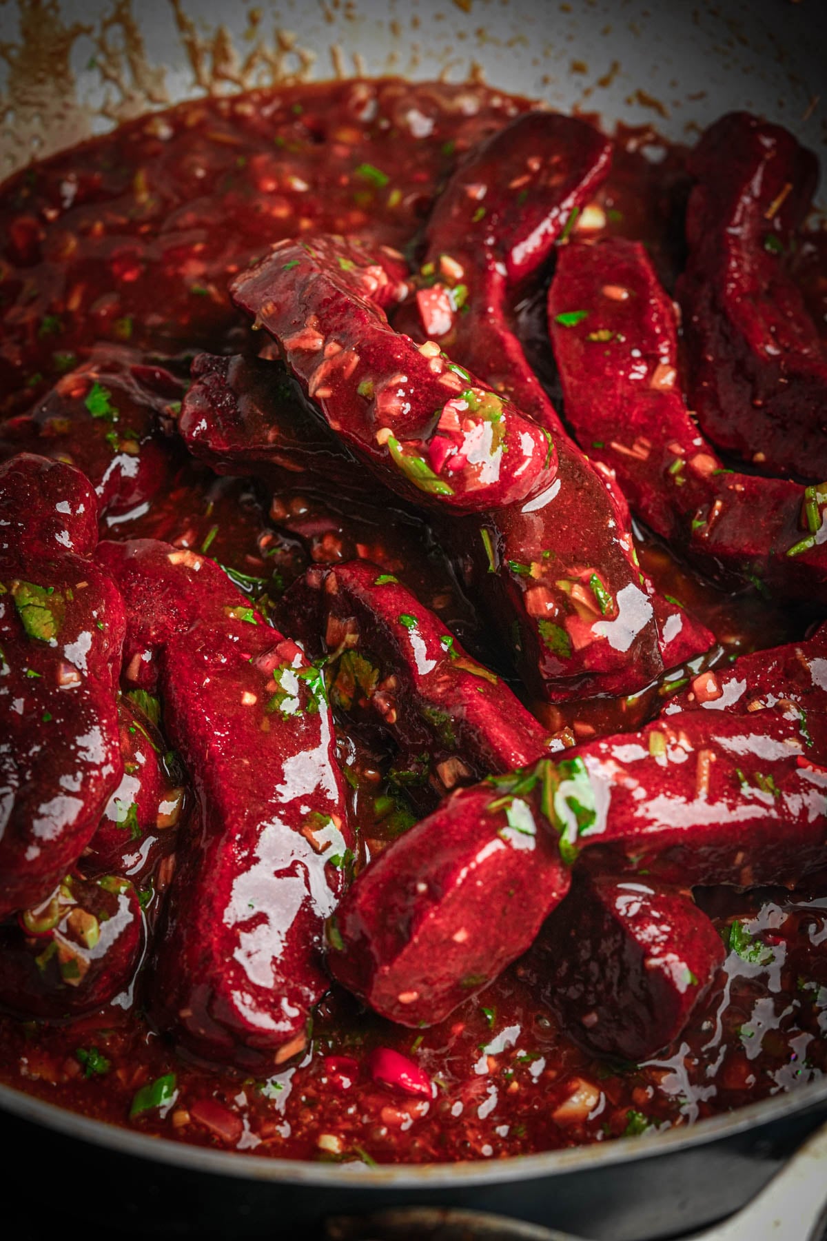 Seitan ribs tossed in the lemongrass, lime and chili sauce until coated.